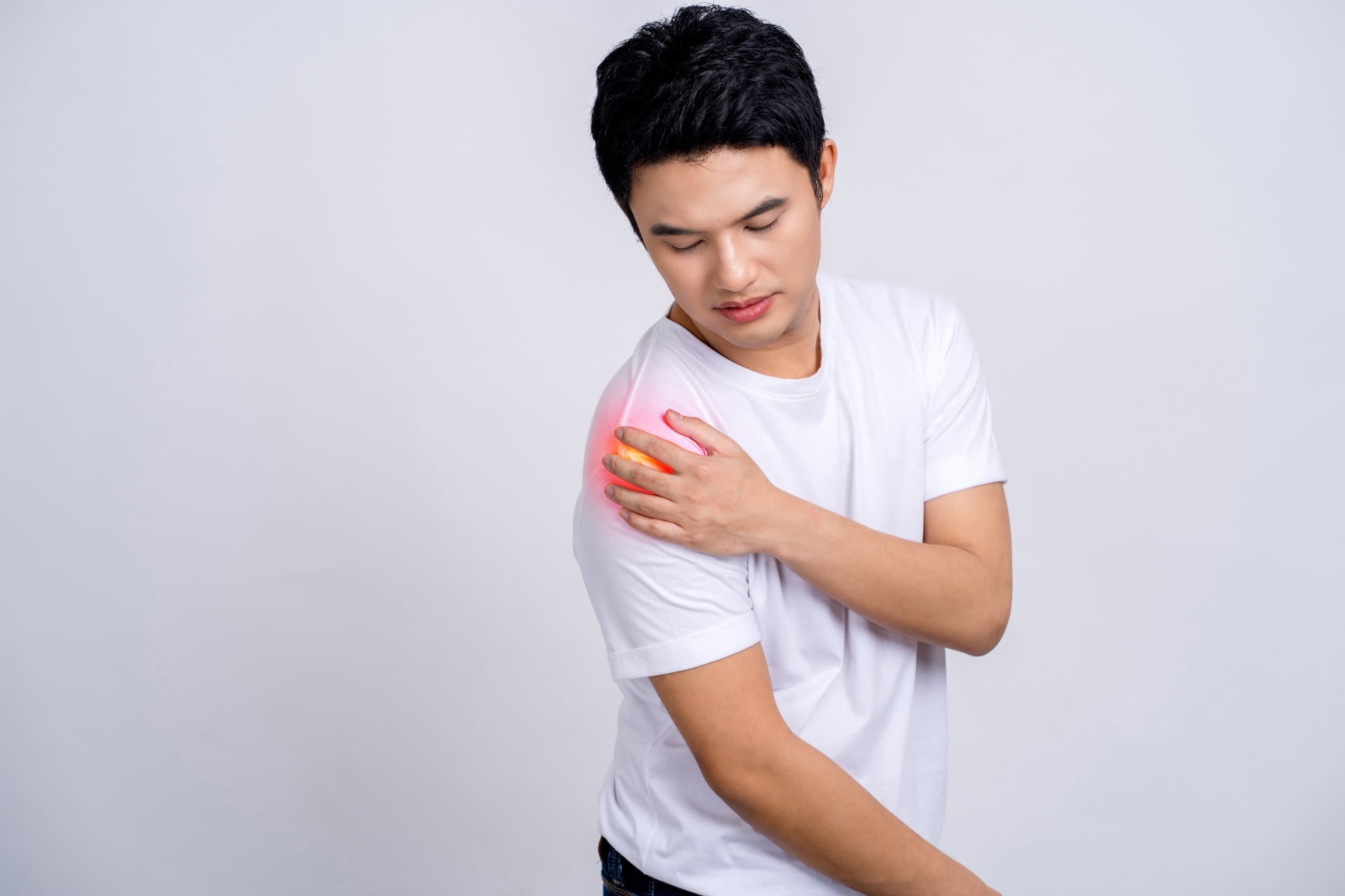 Man holding his shoulder in pain